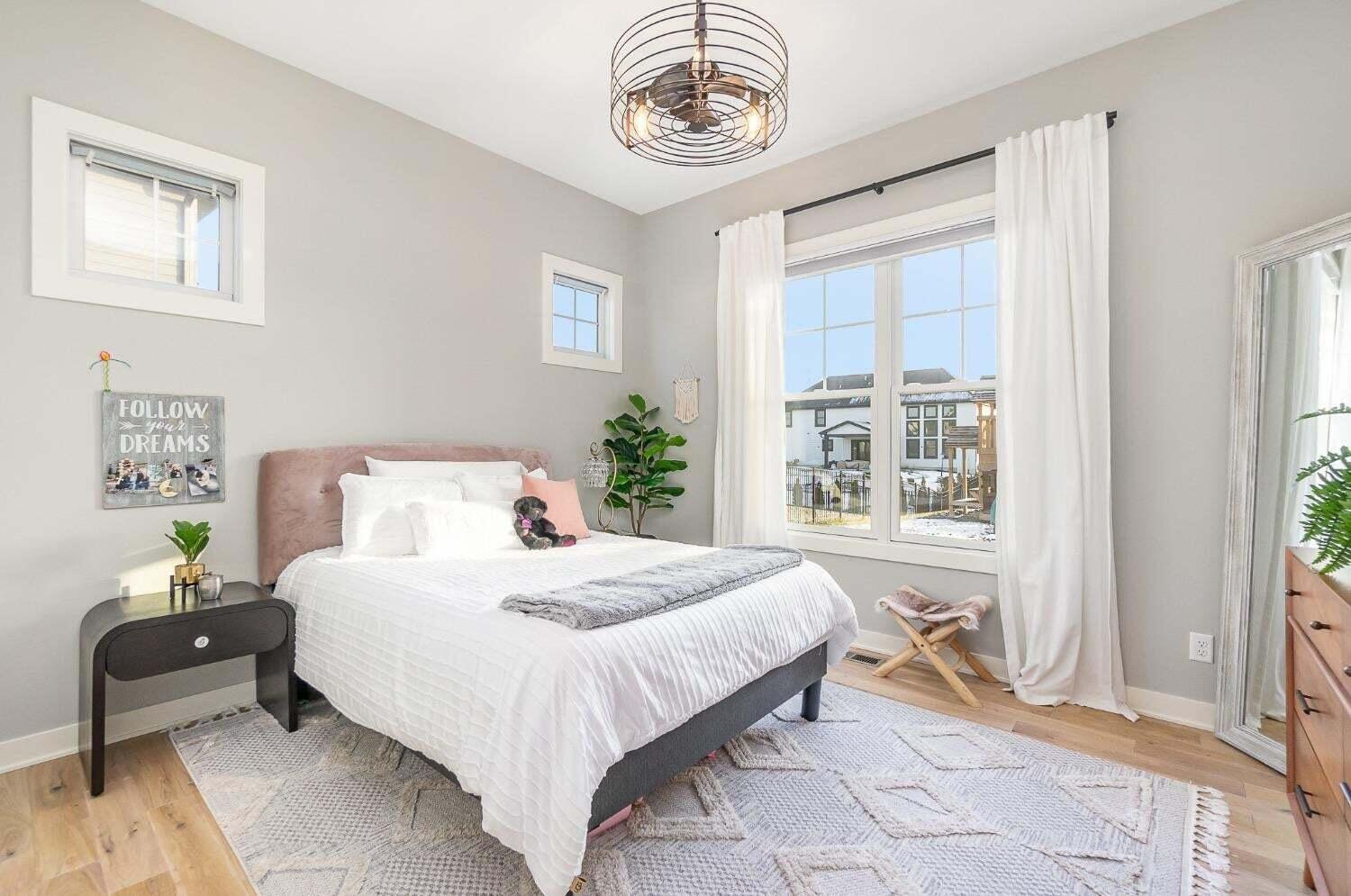 16617 Noble Street Lowell, IN 46356 - Photo 26 of 32 a bedroom with a bed and a window