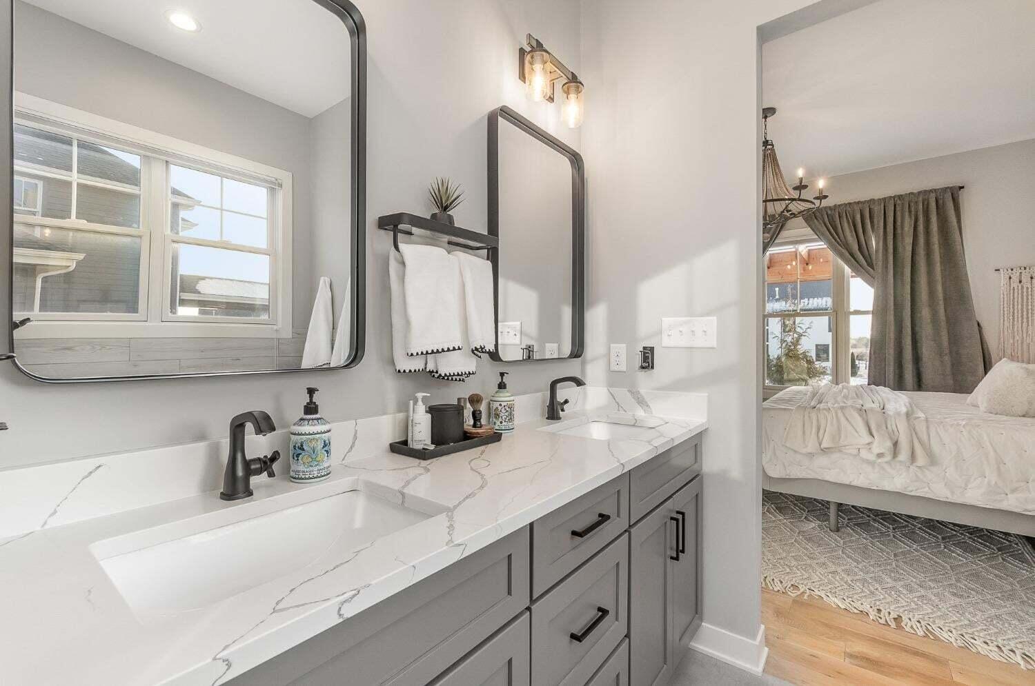 16617 Noble Street Lowell, IN 46356 - Photo 28 of 32 a en suite bathroom with sinks mirror and window