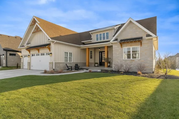 a view of a house with swimming pool and porch