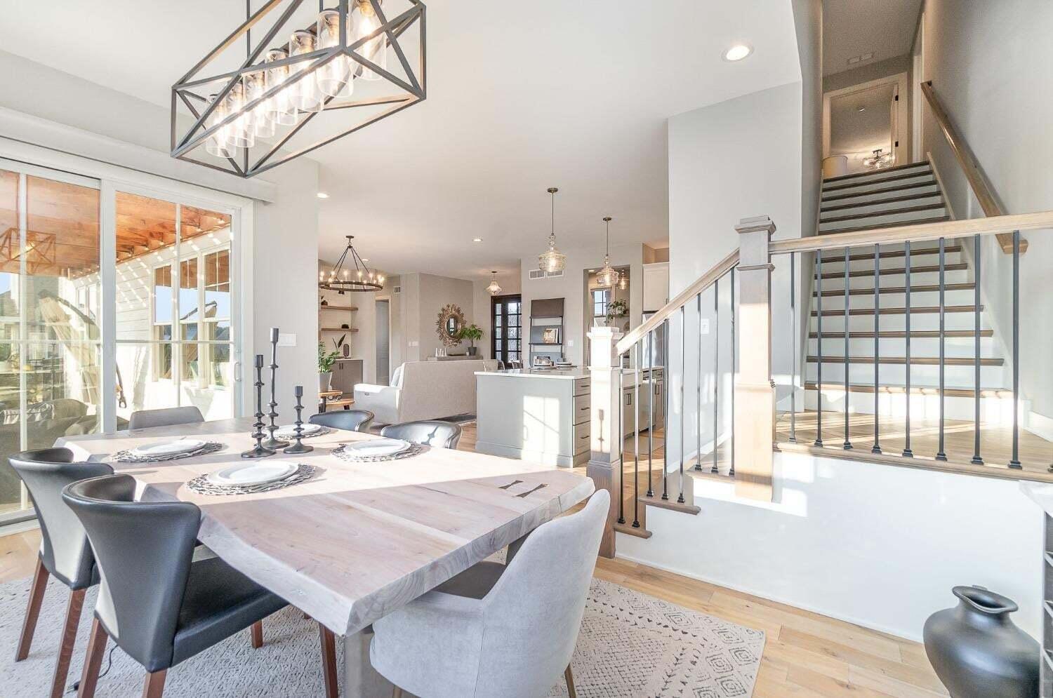 16617 Noble Street Lowell, IN 46356 - Photo 6 of 32 a dining room with wooden floor and large windows