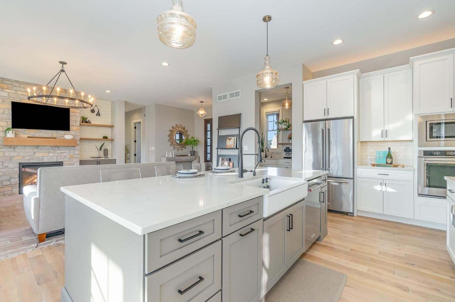 16617 Noble Street Lowell, IN 46356 - Photo 7 of 32 a large kitchen with kitchen island a sink appliances and cabinets