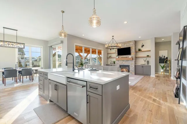 a kitchen with sink stove and refrigerator