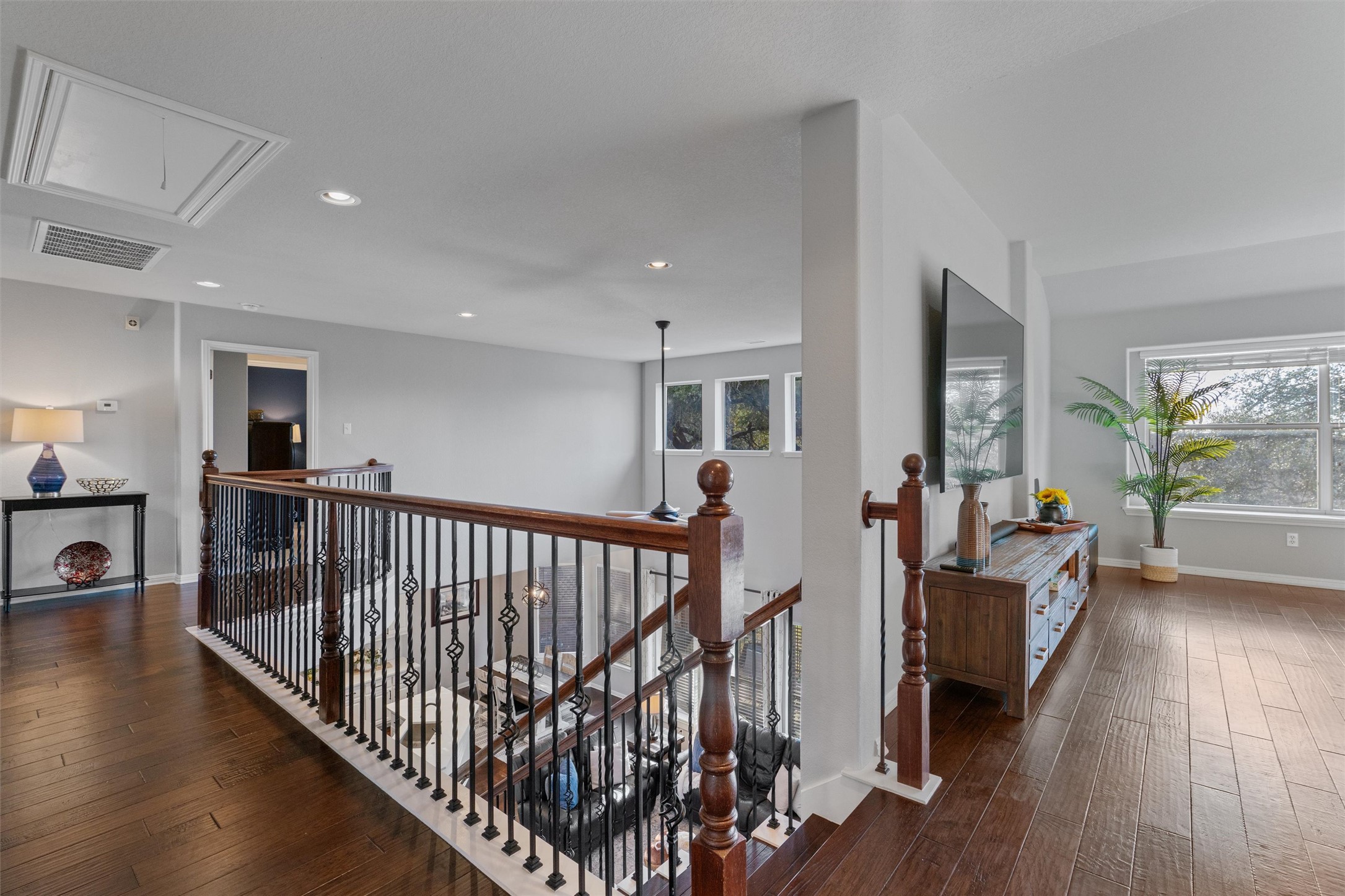 3736 Cerulean Way Round Rock, TX 78681 - Photo 16 of 36 Corridor with an upstairs landing, dark wood finished floors, and recessed lighting