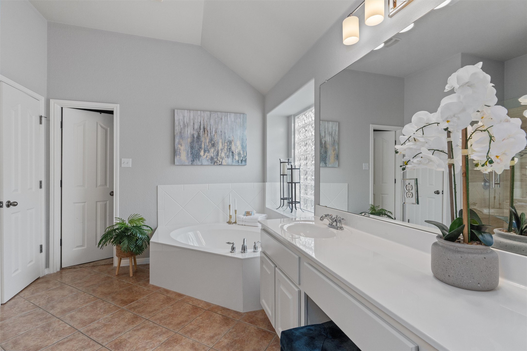3736 Cerulean Way Round Rock, TX 78681 - Photo 23 of 36 Full bath featuring a bath, vanity, vaulted ceiling, and light tile patterned floors