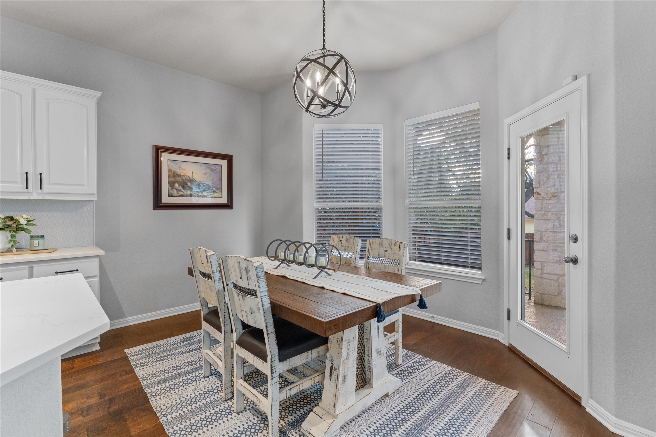 3736 Cerulean Way Round Rock, TX 78681 - Photo 10 of 36 Dining room with dark wood-style flooring and suspended lighting