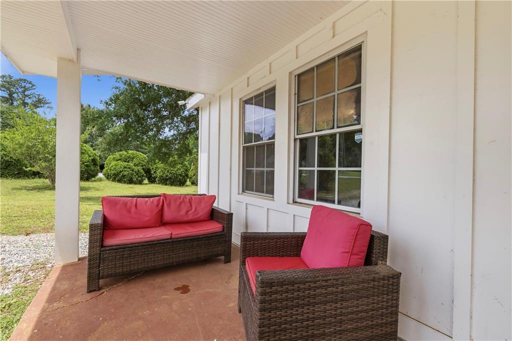 156 Pine Avenue Commerce, GA 30529 - Photo 4 of 35 a living room with furniture and a large window