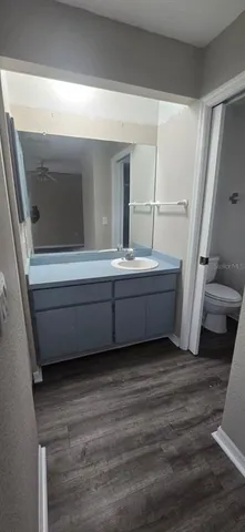 a bathroom with a glass shower door