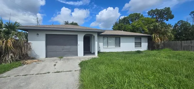 a front view of a house with garage