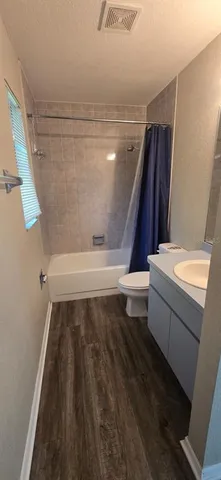 a bathroom with a bathtub and a toilet