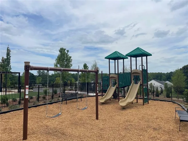 a view of a wrought iron fences in front of house