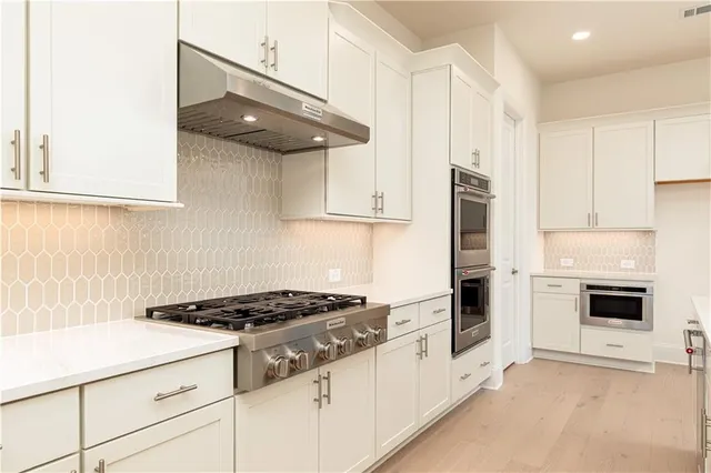 a view of a livingroom with an empty space and a fireplace