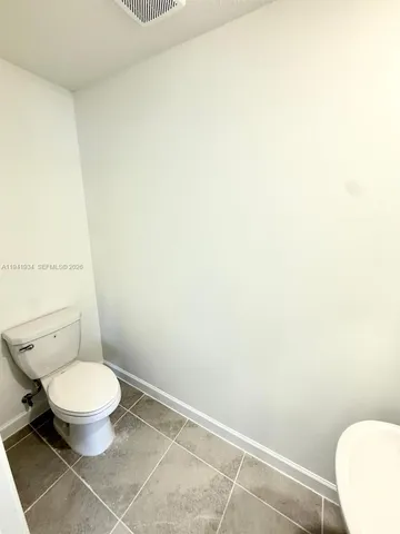 an entryway of a room with a kitchen