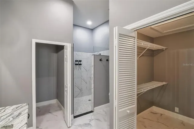 a bathroom with a shower and a sink