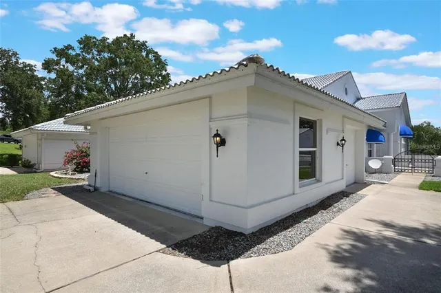 a view of a house with a backyard
