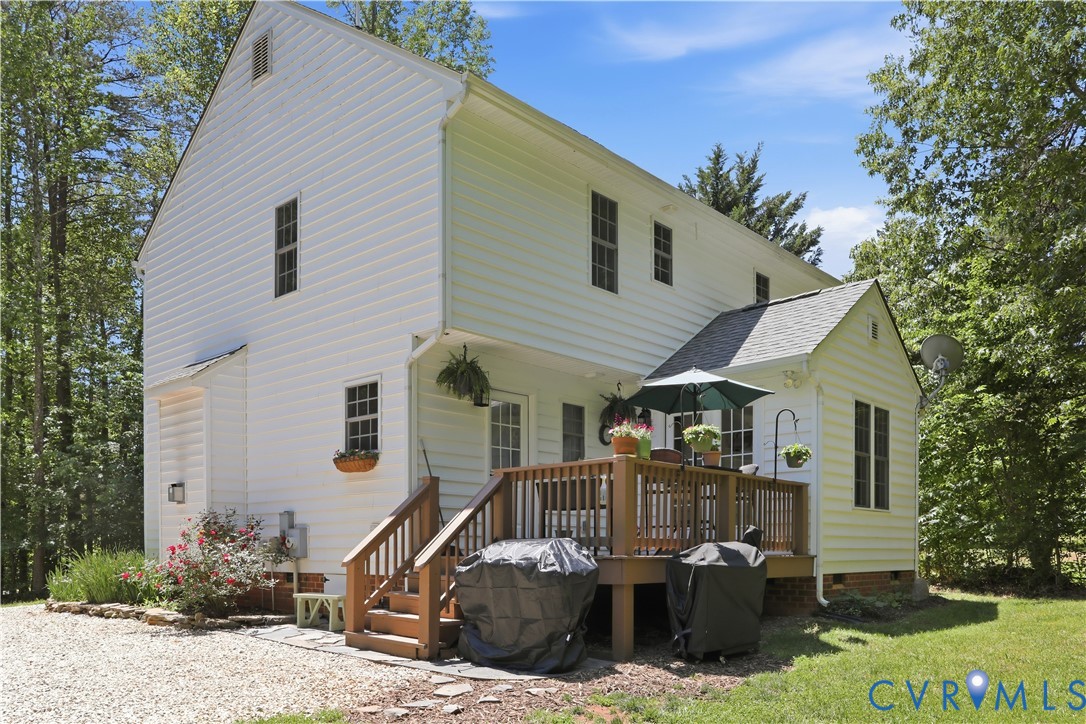 1570 Rock Castle Road Goochland, VA 23063 - Photo 35 of 53 White siding exterior with a multi-level wooden de