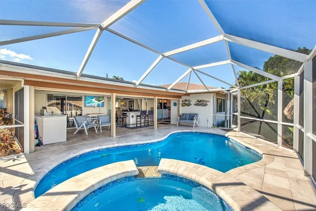 a view of a swimming pool with seating area