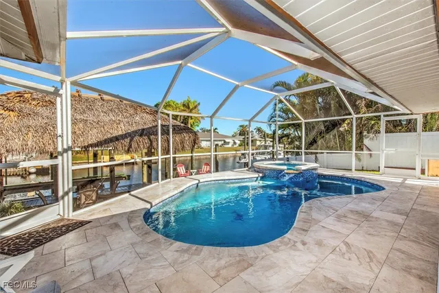 a view of a swimming pool with sitting area