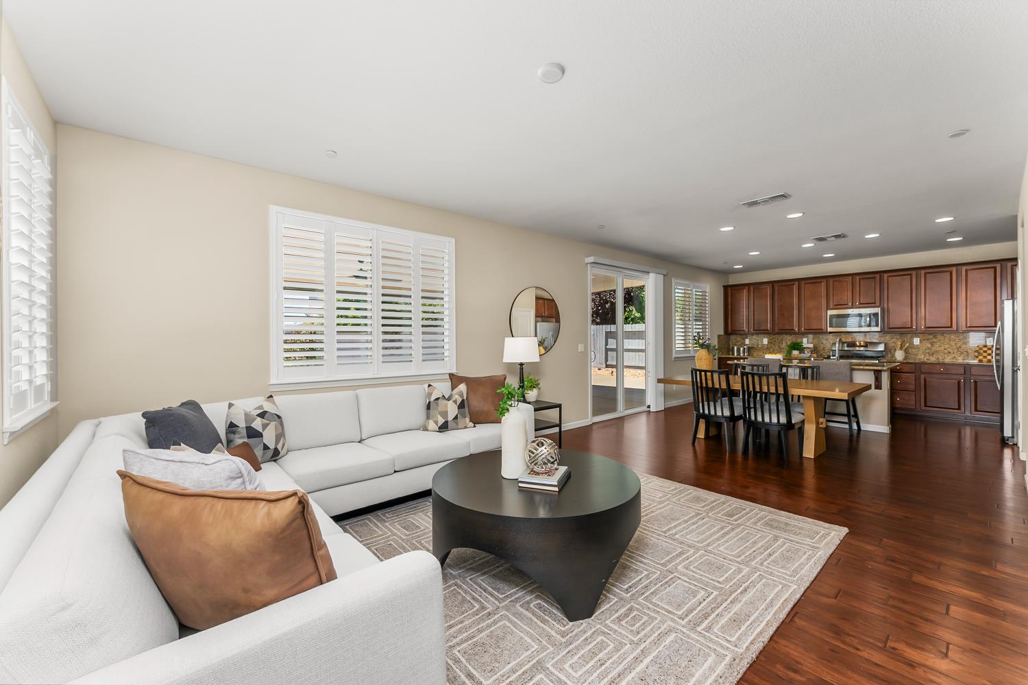 5453 Mossy Stone Way Rancho Cordova, CA 95742 - Photo 29 of 81 a living room with furniture wooden floor and a table