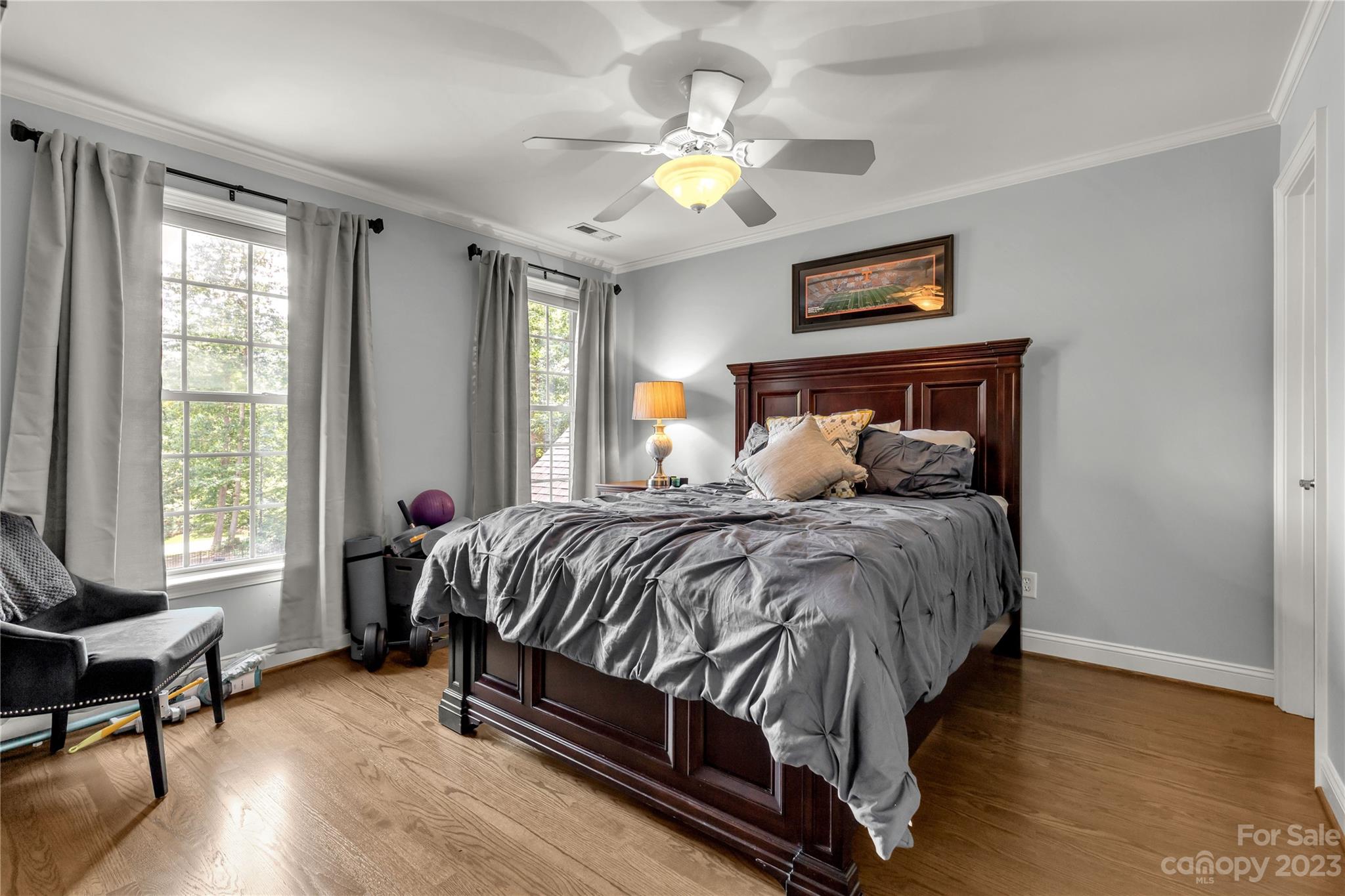 100 Generals Way Clover, SC 29710 - Photo 38 of 48 a bedroom with a bed and a chandelier
