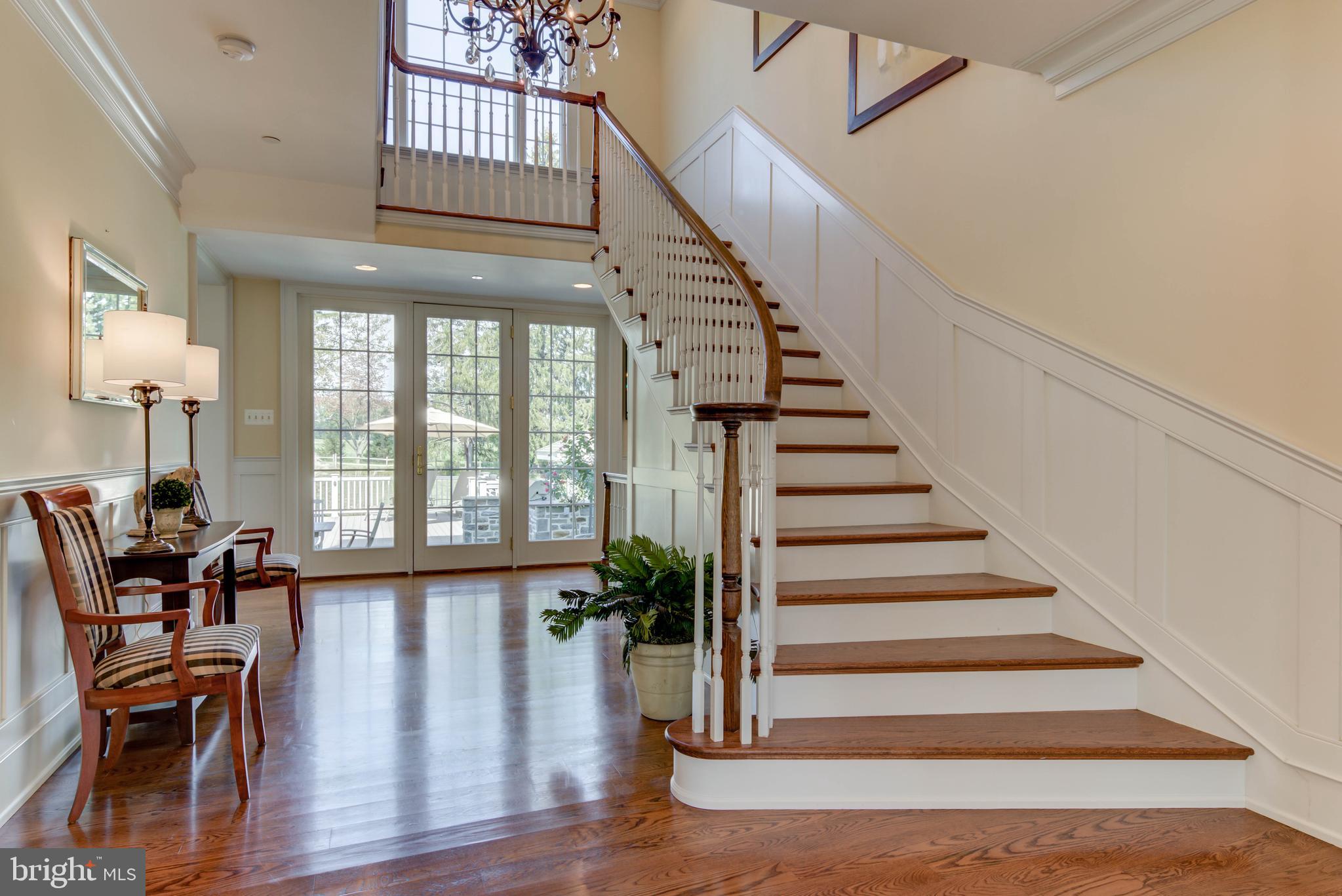Elegant staircase and beautiful hardwood flooring