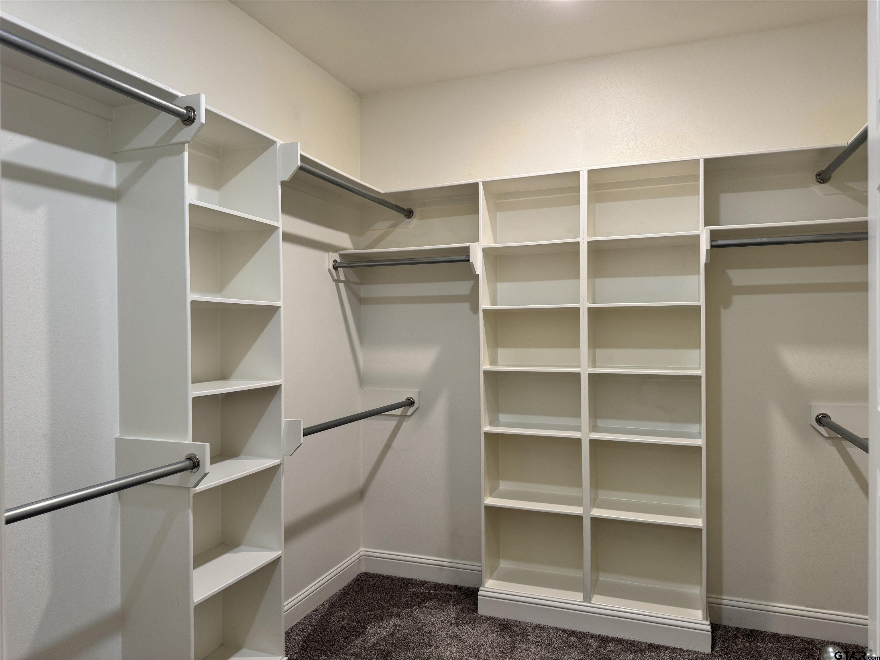 7315 Rolling Acres Place Tyler, TX 75707 - Photo 21 of 37 a view of walk in closet with empty racks