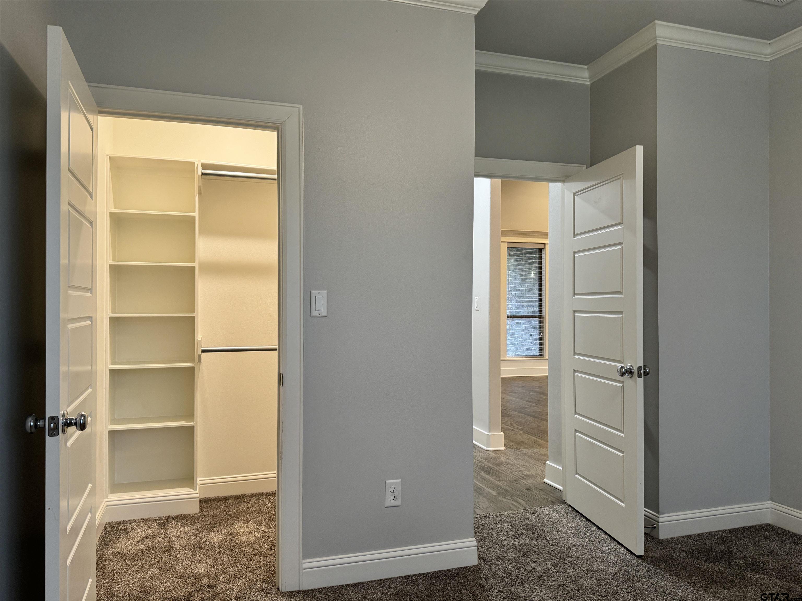 7315 Rolling Acres Place Tyler, TX 75707 - Photo 29 of 37 a view of walk in closet with empty racks