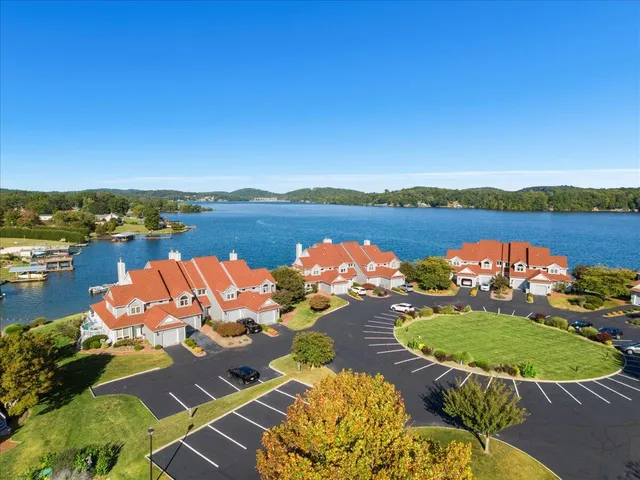 an aerial view of a houses with ocean view