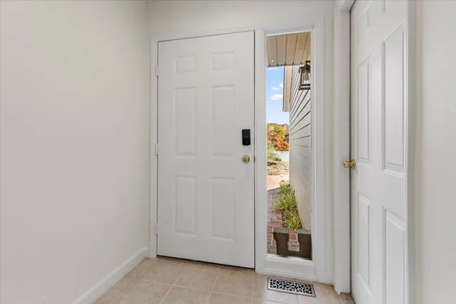 a view of empty room with a fireplace