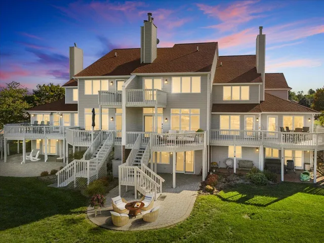 a front view of a house with a yard fountain