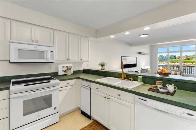 a bath tub sitting next to a white sink