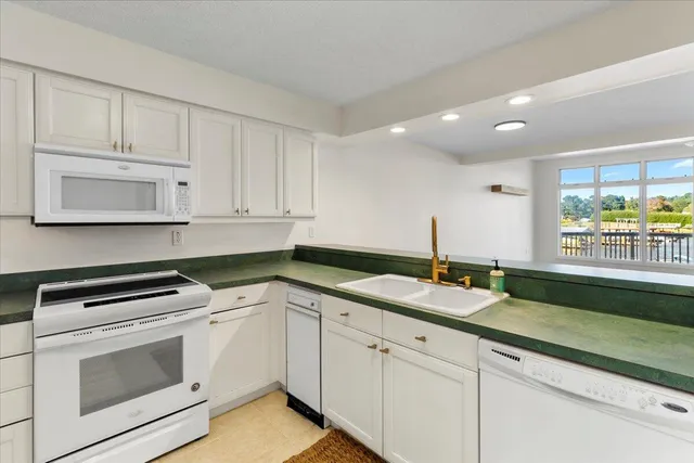 a bedroom with bed and window