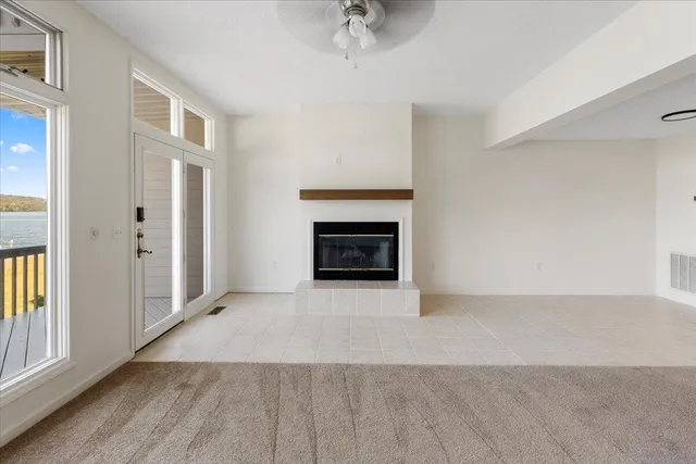 a bathroom with a granite countertop sink a toilet and a mirror