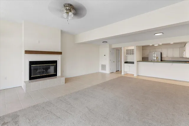 a view of an empty room with windows