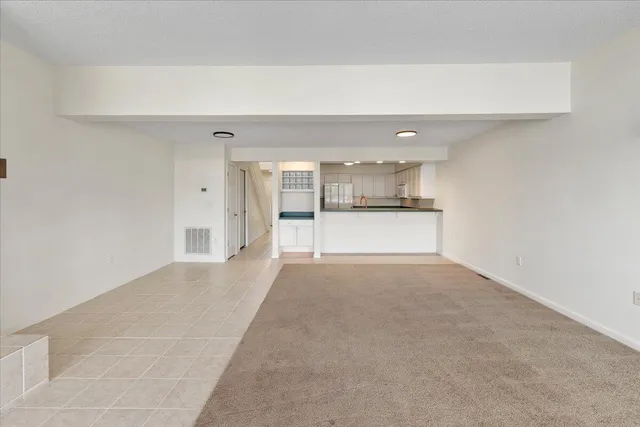 an aerial view of a house with a lake view