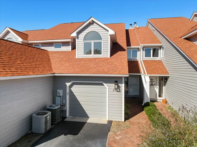 a front view of a house with garage