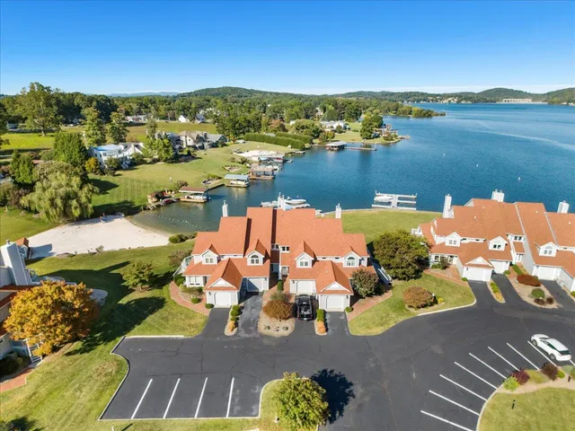an aerial view of a house with a ocean view
