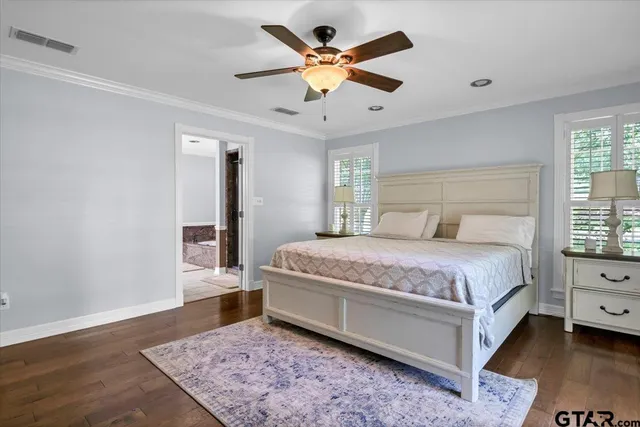 a spacious bedroom with a bed and a table