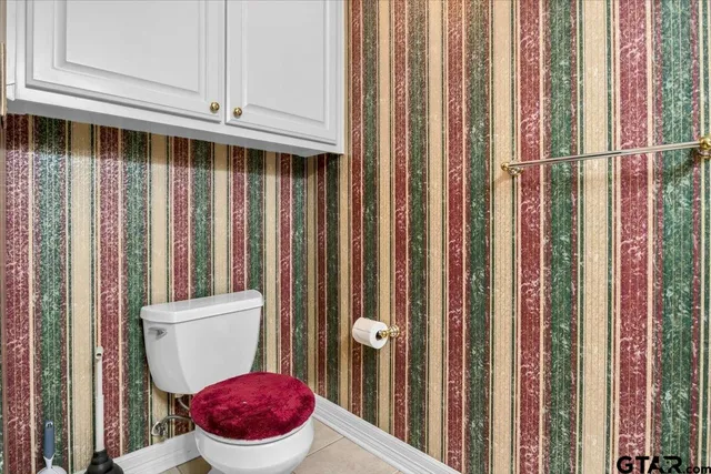 a bathroom with a toilet and a sink