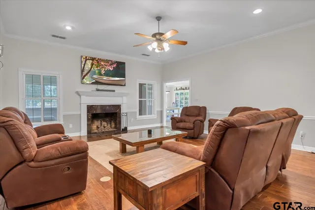a living room with furniture and a fireplace