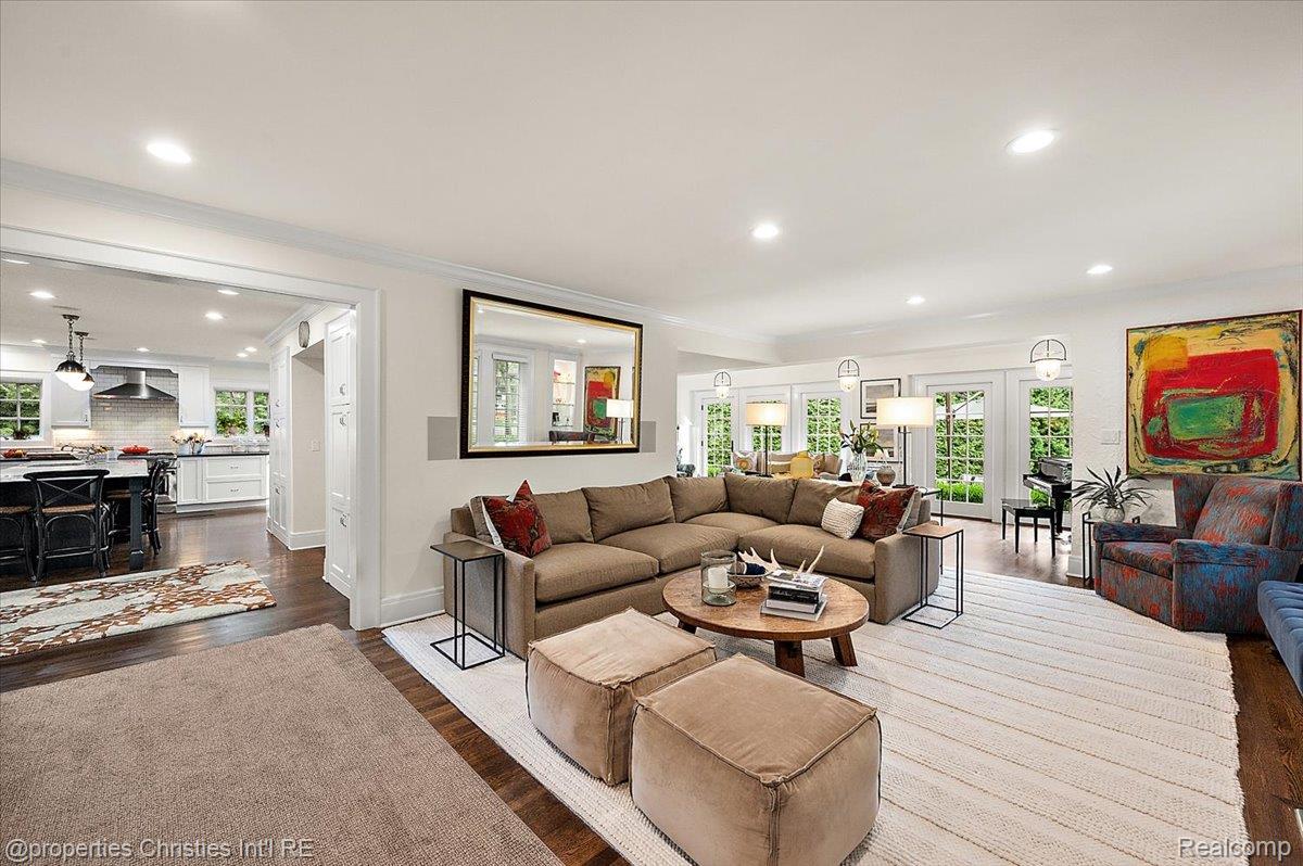 528 Covington Road Bloomfield Hills, MI 48301 - Photo 5 of 75 Expansive living area featuring rich wood-finish flooring, recessed lighting, and multiple French doors providing abundant natural light