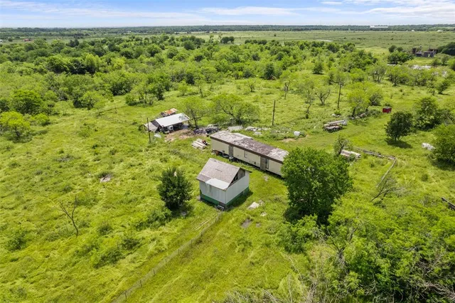 a view of a garden with an outdoor seating