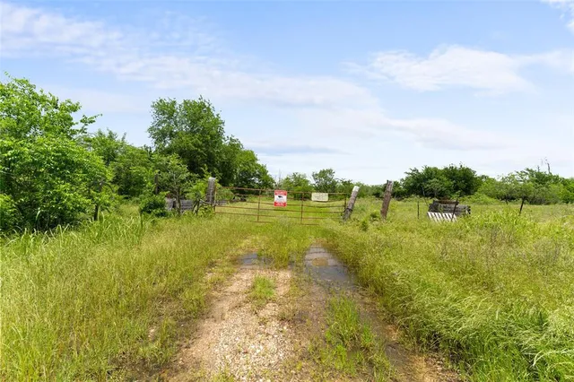 a view of lake with green space