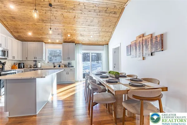 a kitchen with a table and chairs in it