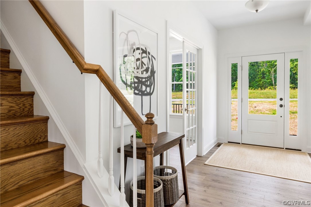 8357 Capernwray Drive Chesterfield, VA 23838 - Photo 11 of 50 a view of an entryway with wooden floor and windows