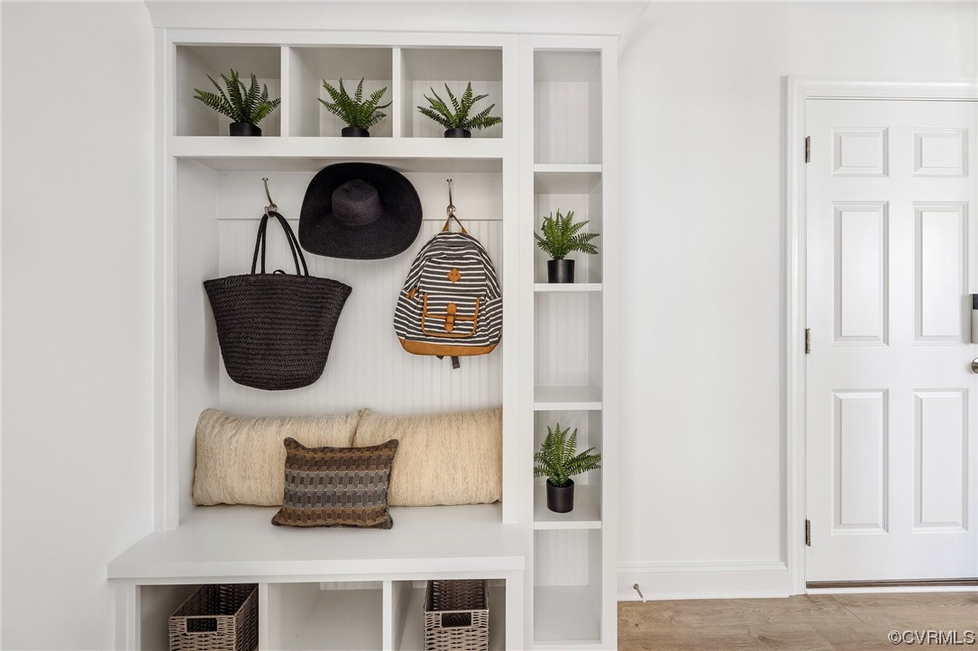 8357 Capernwray Drive Chesterfield, VA 23838 - Photo 17 of 50 a room with wooden floor and a potted plant