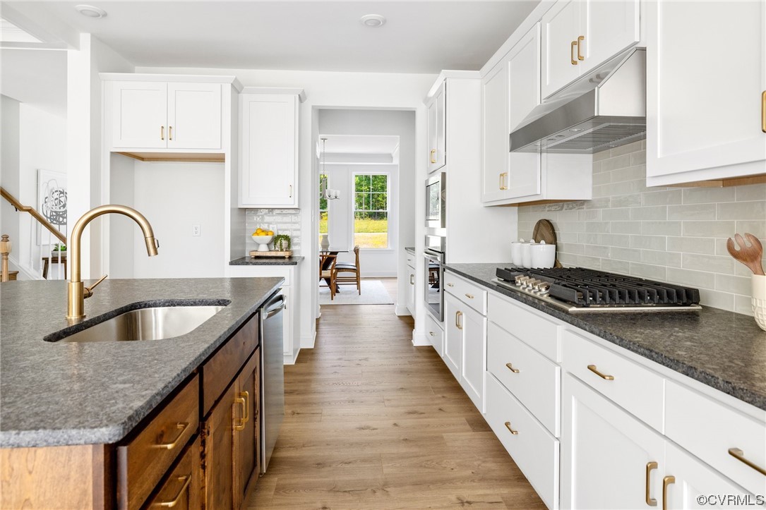 8357 Capernwray Drive Chesterfield, VA 23838 - Photo 22 of 50 a kitchen with granite countertop a sink and cabinets