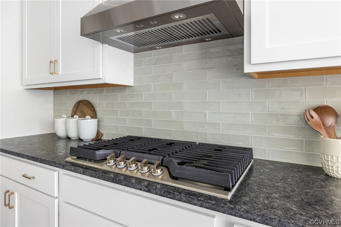 8357 Capernwray Drive Chesterfield, VA 23838 - Photo 23 of 50 a close view of a stove a microwave and cabinets