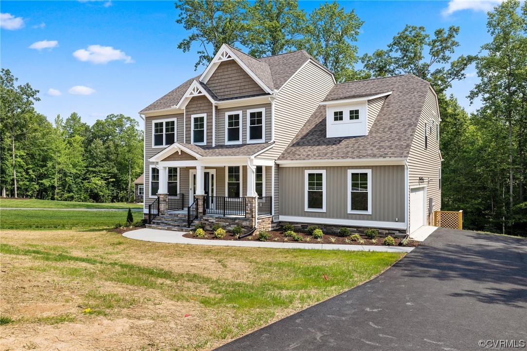8357 Capernwray Drive Chesterfield, VA 23838 - Photo 3 of 50 a front view of a house with garden