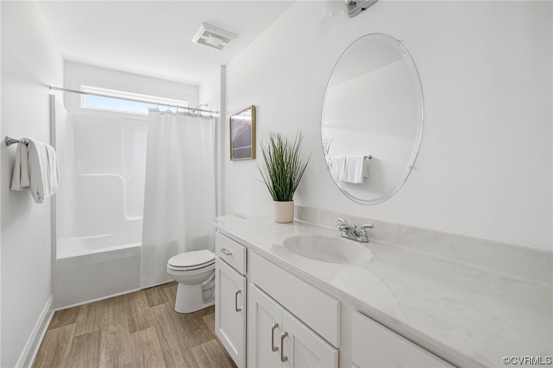 8357 Capernwray Drive Chesterfield, VA 23838 - Photo 37 of 50 a bathroom with a sink a toilet and a mirror