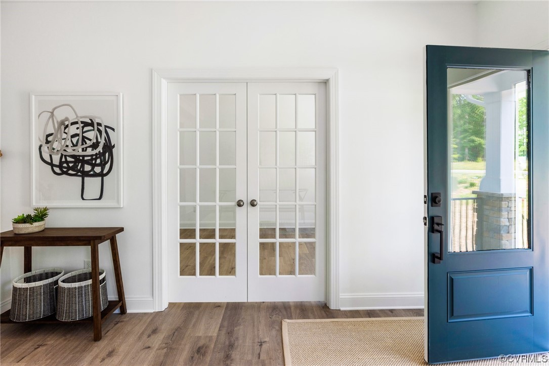 8357 Capernwray Drive Chesterfield, VA 23838 - Photo 4 of 50 a view of a room with wooden floor and windows